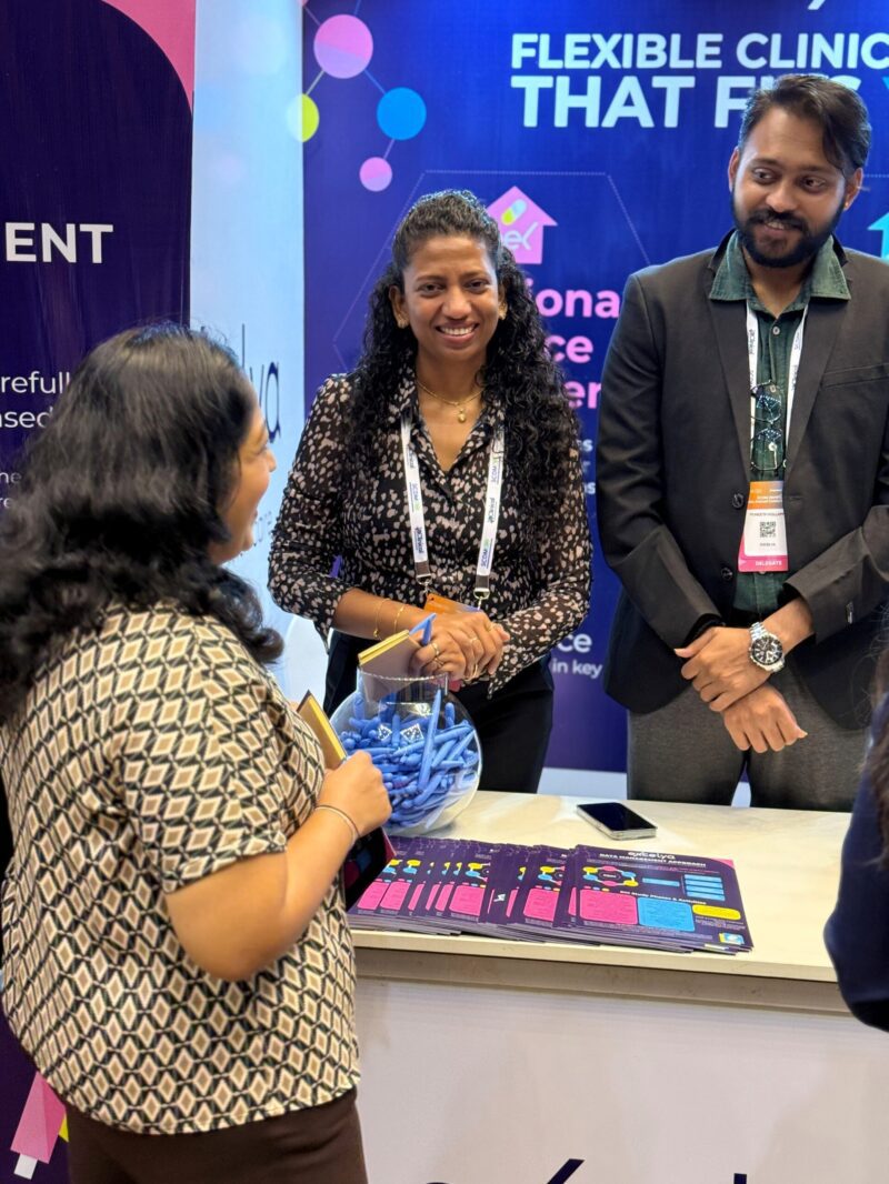 Excelya team engaging with clinical data professionals at SCDM India 2025 conference in Hyderabad, discussing the future of clinical data management.