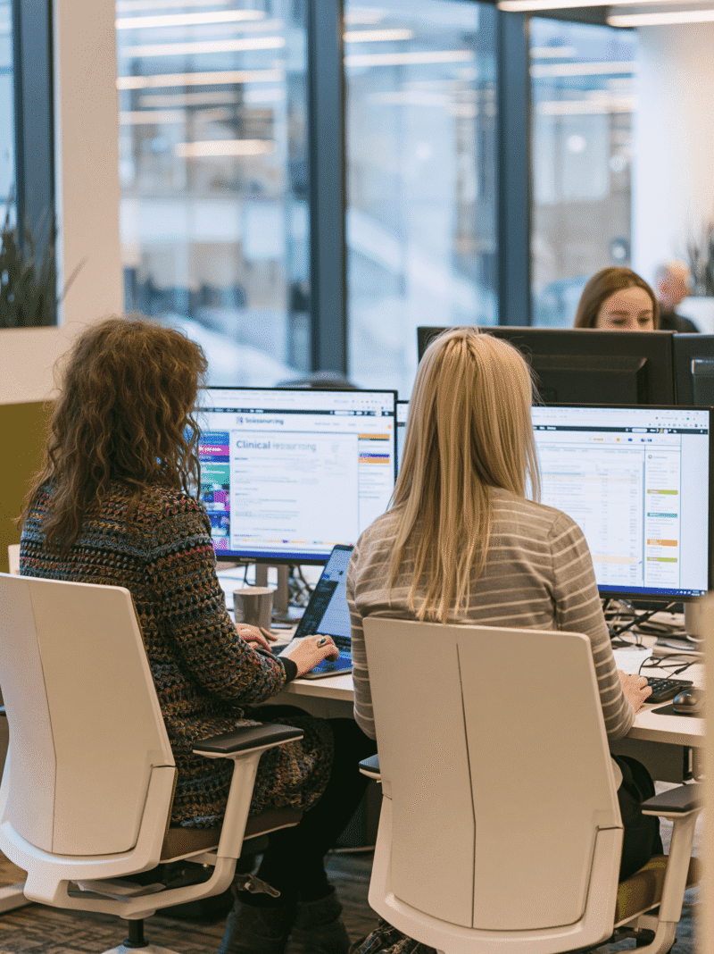 Clinical resourcing professionals working in a collaborative office environment to support clinical research and clinical development projects at Excelya.